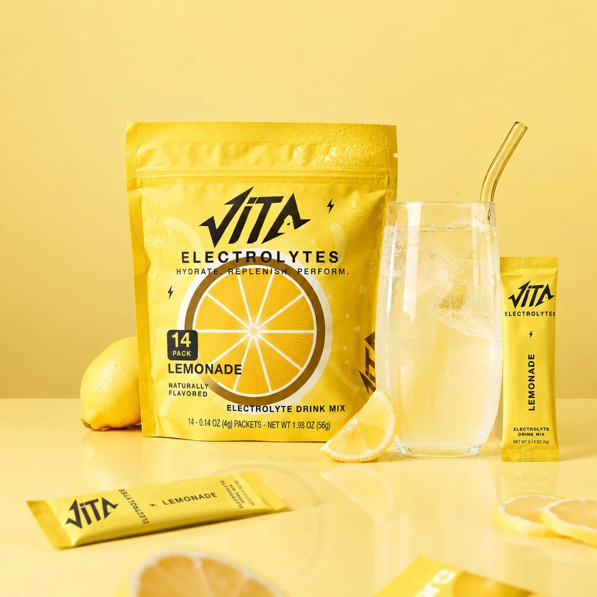 Sachet VITA Citronnade, un verre d’eau et des citrons